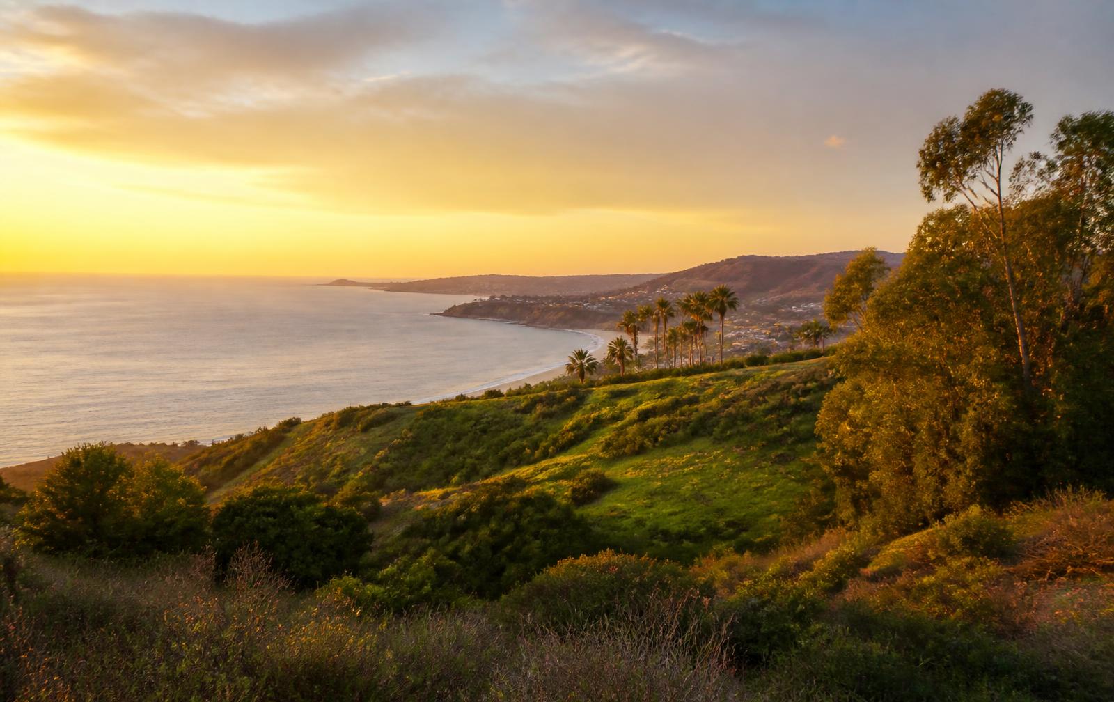 Newport Coast hillside and Pacific Ocean at sunset near the Verona community